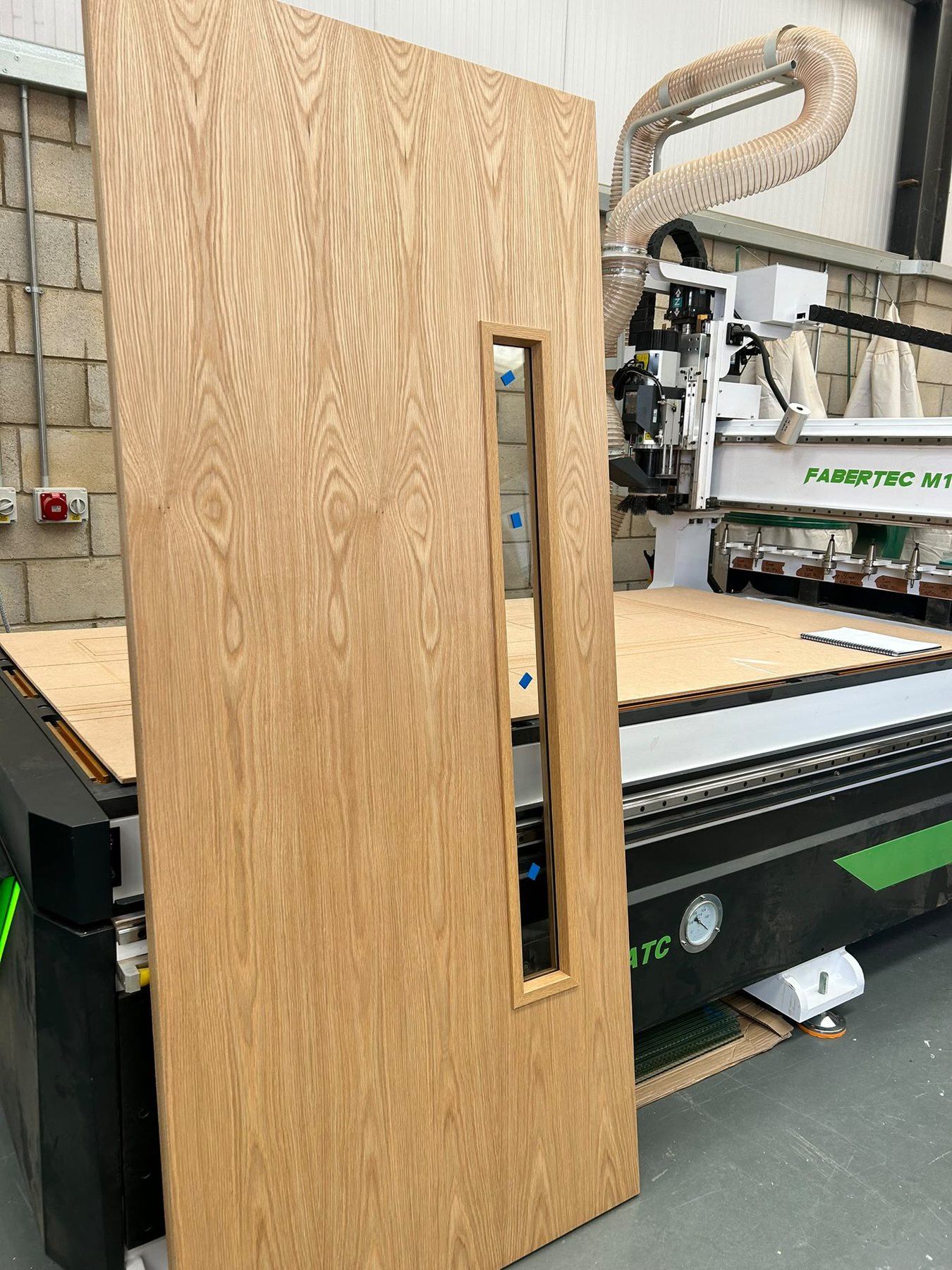 Glazed timber fire door manufactured by Cerberus